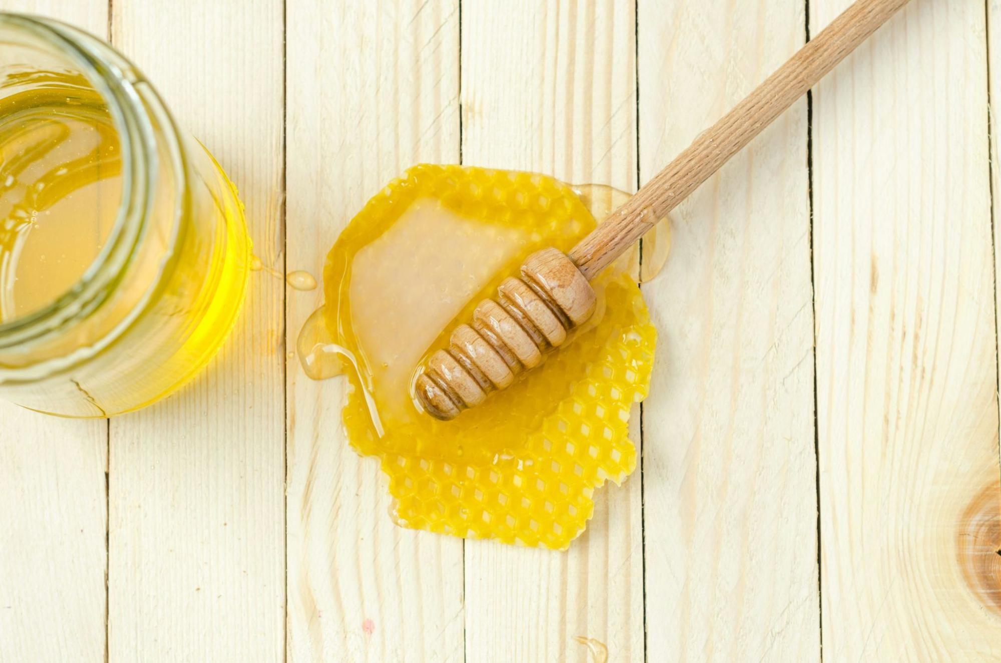 honey dipper on honeycomb